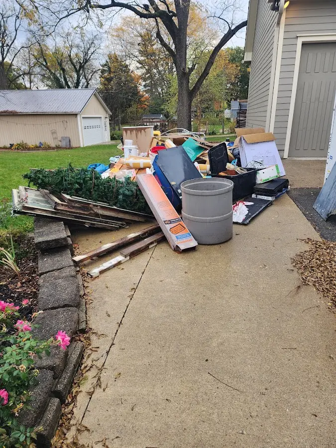 Dumpster being loaded with debris for Demolition Dumpster Rental in Ivanhoe